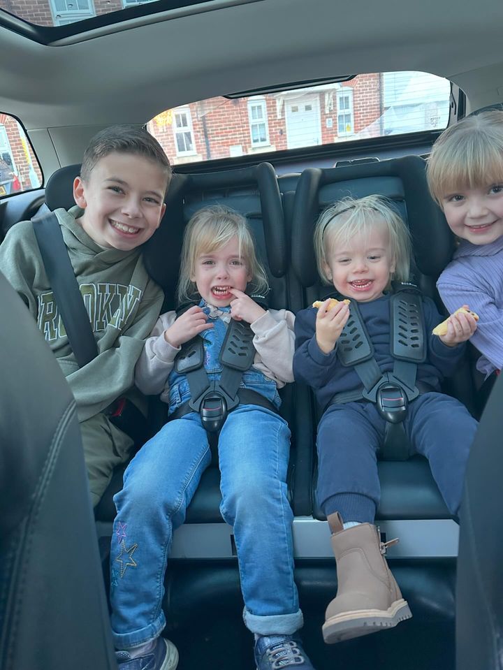 1260 in Range Rover Evoque Four children in the back of a Range Rover Evoque